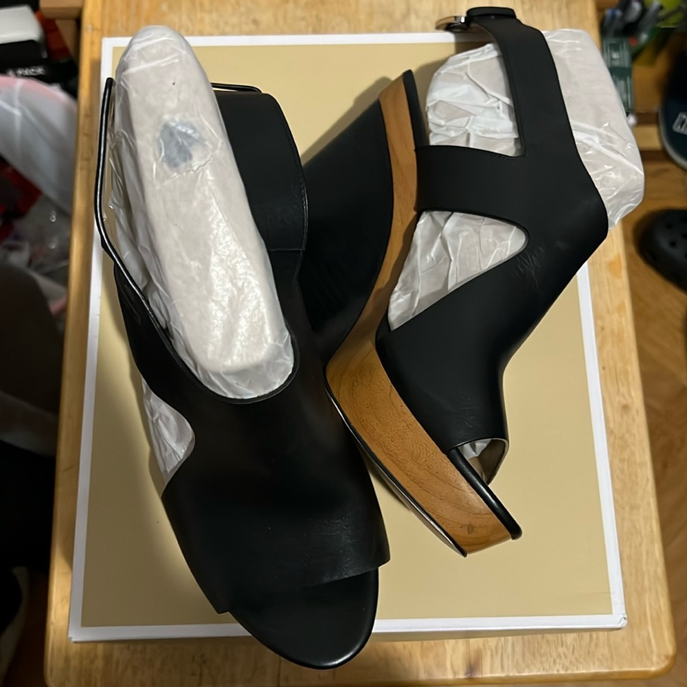 Brand new Michael Kors black leather wedges size 9.
